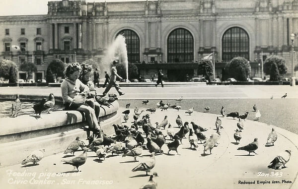 Feeding pigeons, San Francisco, California, USA