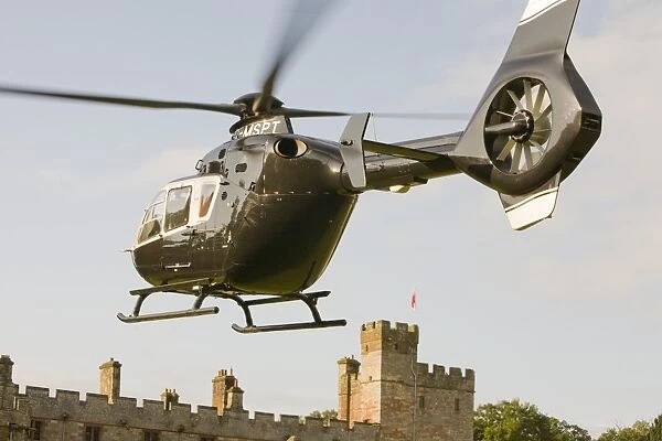 A private helicopter arriving at Narworth Castle in North Cumbria UK