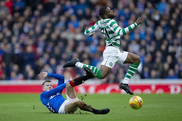 Intense Rivalry: Halliday Tackles Ntcham at Ibrox - Scottish Premiership Clash between Rangers and Celtic (2003 Scottish Cup Winners)
