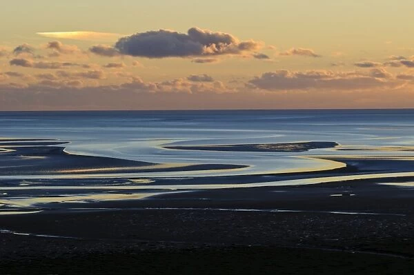 View across bay with channels in sand, at low tide in evening light, Humphrey Head, Morecambe Bay, Cumbria, England
