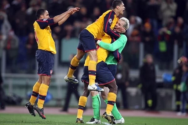 Manuel Almunia and Arsenal Teammates Celebrate Penalty Shootout Victory over AS Roma in UEFA Champions League