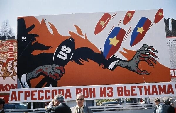 Aggressors out of vietnam! reads a cold war era billboard on a moscow street showing bombs raining down on uncle sam (usa), may 1, 1968