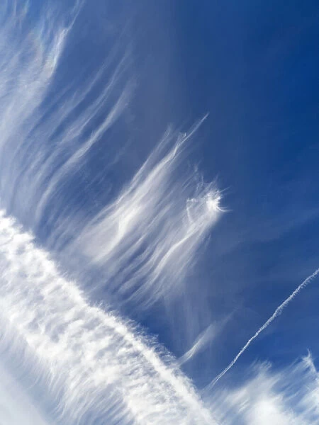 Cloudscape with alto cirrus and contrails over the Thames at Oxford, England