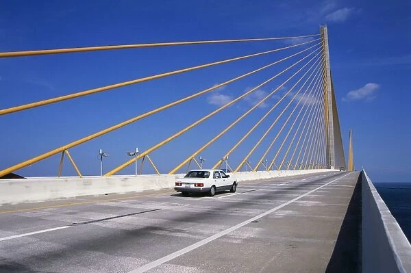 USA, Florida, Tampa Bay, car driving along Sunshine Skyway Bridge