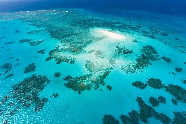 Aerial view of coral cay and Great Barrier Reef