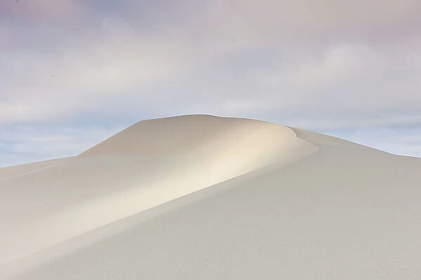 Light on sand dune with pastel skies