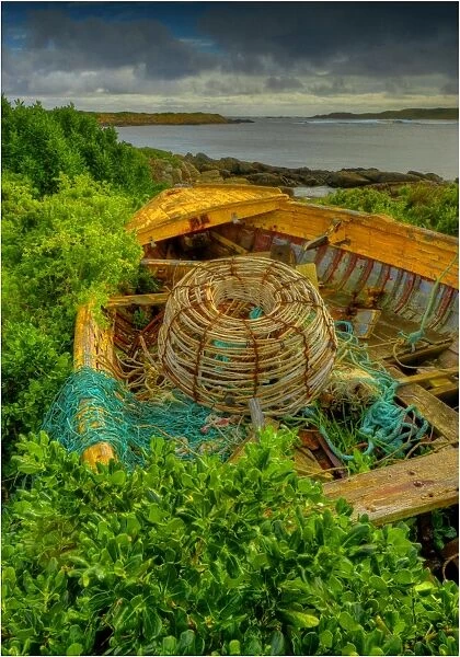 Old derelict boat and Lobster pot at the Currie foreshore, King Island, Bass Strait, Tasmania, Australia