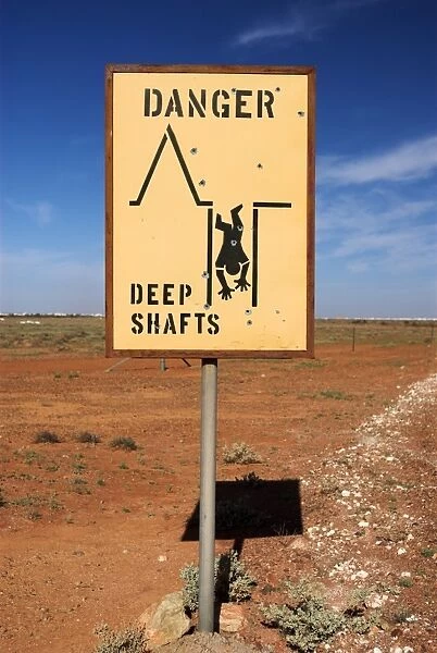 Road sign warning of mine shafts, Coober Pedy, South Australia, Australia