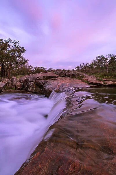 Sunrise over granite waterfalls in Western Australian Landscape