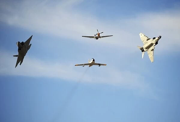 A F-22 Raptor, F-86 Sabre, P-51 Mustang and F-4 Phantom in a heritage flight