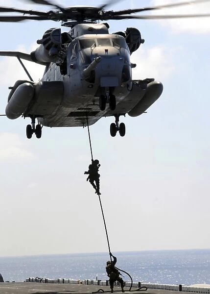Marines rappel from a CH-53E Sea Stallion helicopter