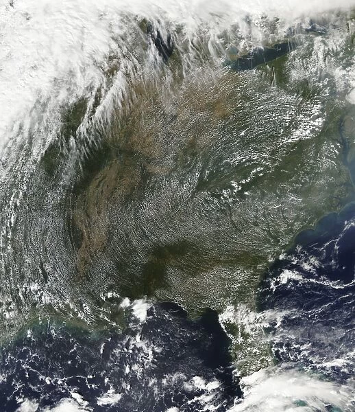 A pinwheel-like pattern of high pressure clouds stretches across the eastern United