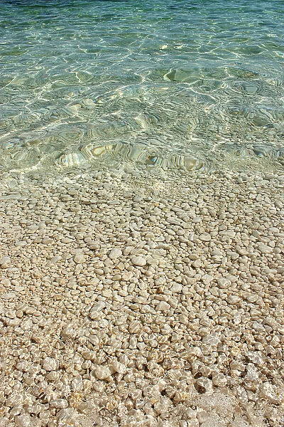 Aqua Ocean and Golden Pebbles