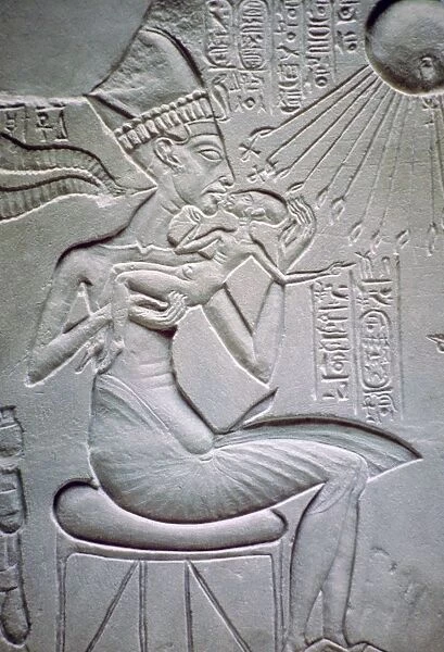 Akhenaten holding one of his daughters