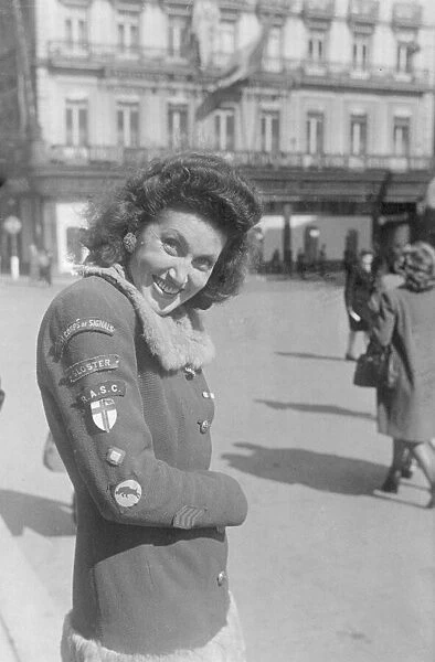 A Brussels girl whose hobby is collecting badges from the liberating Allied troops