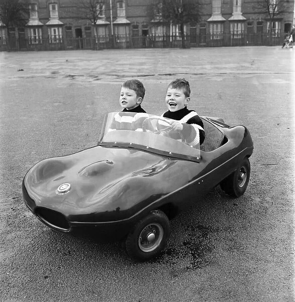 Young drivers: Small boys driving miniature cars. January 1966 F94
