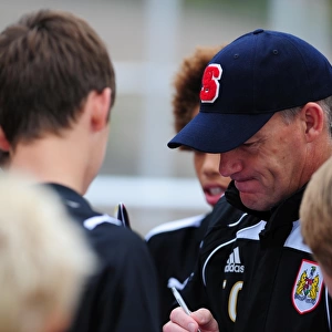 Bristol City Manager, Steve Coppell signs autographs for the academy players