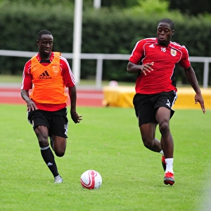 Bristol Citys Albert Adomah battles for the ball with Bristol Citys John Akinde