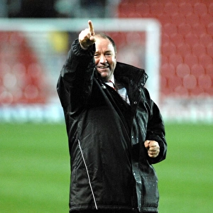 Gary Johnson points to the travelling supporters on the final whistle