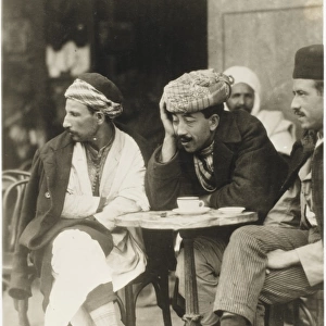 Algerian men drinking outside a cafe - Algiers