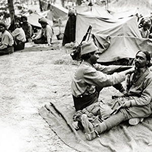Indian barber at work, Western Front, WW1