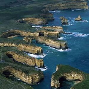 Aerial - Port Campbell National Park with Muttonbird Island in foreground, the Island Archway, and Twelve Apostles beyond, Victoria, Australia JPF49012