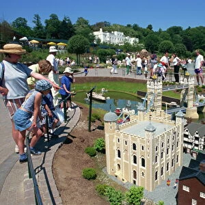 People admiring models of the Tower of London and Tower Bridge, Legoland amusement park