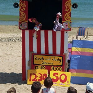 Punch & Judy show on the beach at Swanage, Dorset, England, United Kingdom, Europe