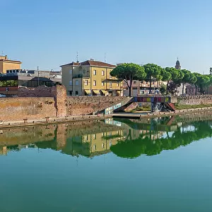 View of buildings and reflections on the Rimini Canal, Rimini, Emilia-Romagna, Italy, Europe