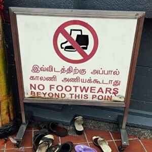 No footwear sign and shoes outside a temple in Singapore, Republic of Singapore
