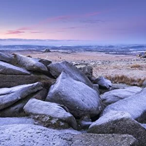 Frost covered granite boulders at Great Staple Tor in Dartmoor National Park, Devon, England
