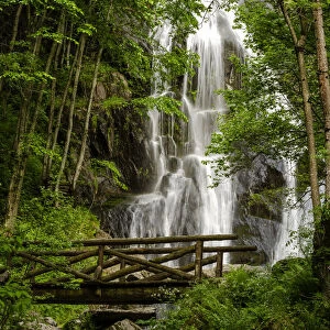 Saut waterfall and the wooden bridge in Pesio Valley, Chiusa Pesio, Piedmont, Italy