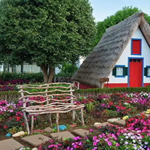 Traditional thatch house with flowers, Santana, Madeira, Portugal