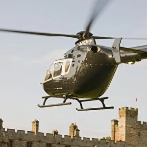 A private helicopter arriving at Narworth Castle in North Cumbria UK