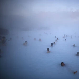 People relax in one of the Blue Lagoon hot springs near the town of Grindavik