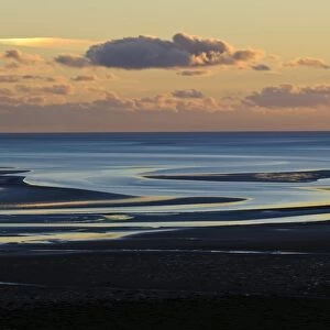 View across bay with channels in sand, at low tide in evening light, Humphrey Head, Morecambe Bay, Cumbria, England