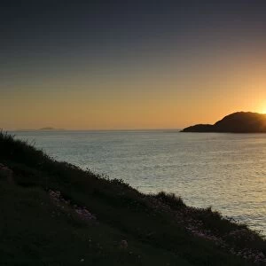 View from cliffs across Irish Sea at sunset, St. Davids Head, Pembrokeshire, Wales, May