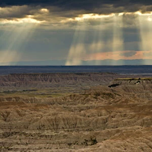 approaching storm and crepuscular rays, sunset, Pinnacles Viewpoint, Badlands National Park