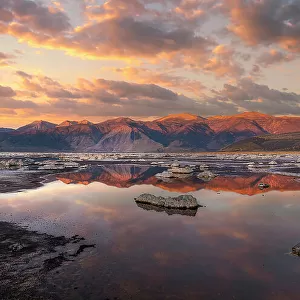 Sierra Nevada sunrise reflects in Mono Lake