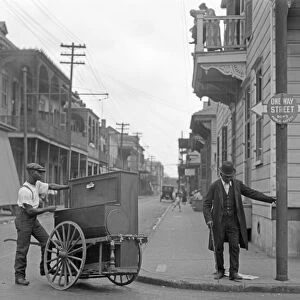 NEW ORLEANS, c1925. An organ grinder on the street in New Orleans, Louisiana