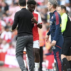 Arsenal's Bukayo Saka Interacts with Mikel Arteta after Substitution vs. Wolverhampton Wanderers (2022-23)
