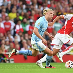 Arsenal's Saliba Faces Haaland Pressure: Arsenal FC vs Manchester City, 2023-24 Premier League