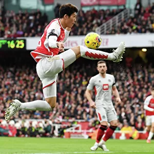Arsenal's Tomiyasu in Control: Arsenal FC vs Sheffield United, Premier League 2023-24