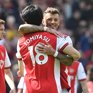 Arsenal's White and Tomiyasu Celebrate Victory Over Manchester United in Premier League
