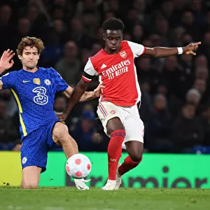 Bukayo Saka Outsmarts Marcos Alonso: A Premier League Showdown at Stamford Bridge, 2021-22