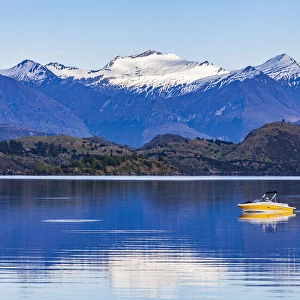 A speedboat crossing Lake Wanaka in Otago, New Zealand
