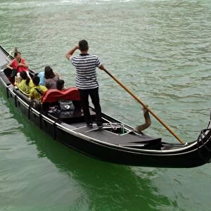 Italy, Venice, Tourists in gondola on Grand canal