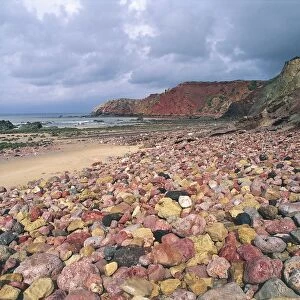 Portugal, Algarve, Low tide on Atlantic coast that uncover colored pebbles