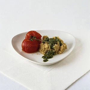 Quinoa with pesto and roast tomatoes, served on triangular platter