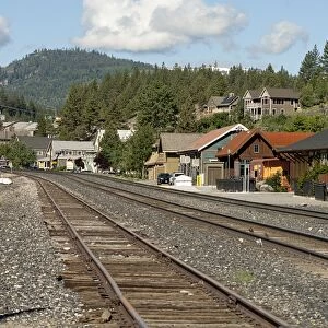 USA, California, North Lake Tahoe, Truckee Railway Station below forested hills